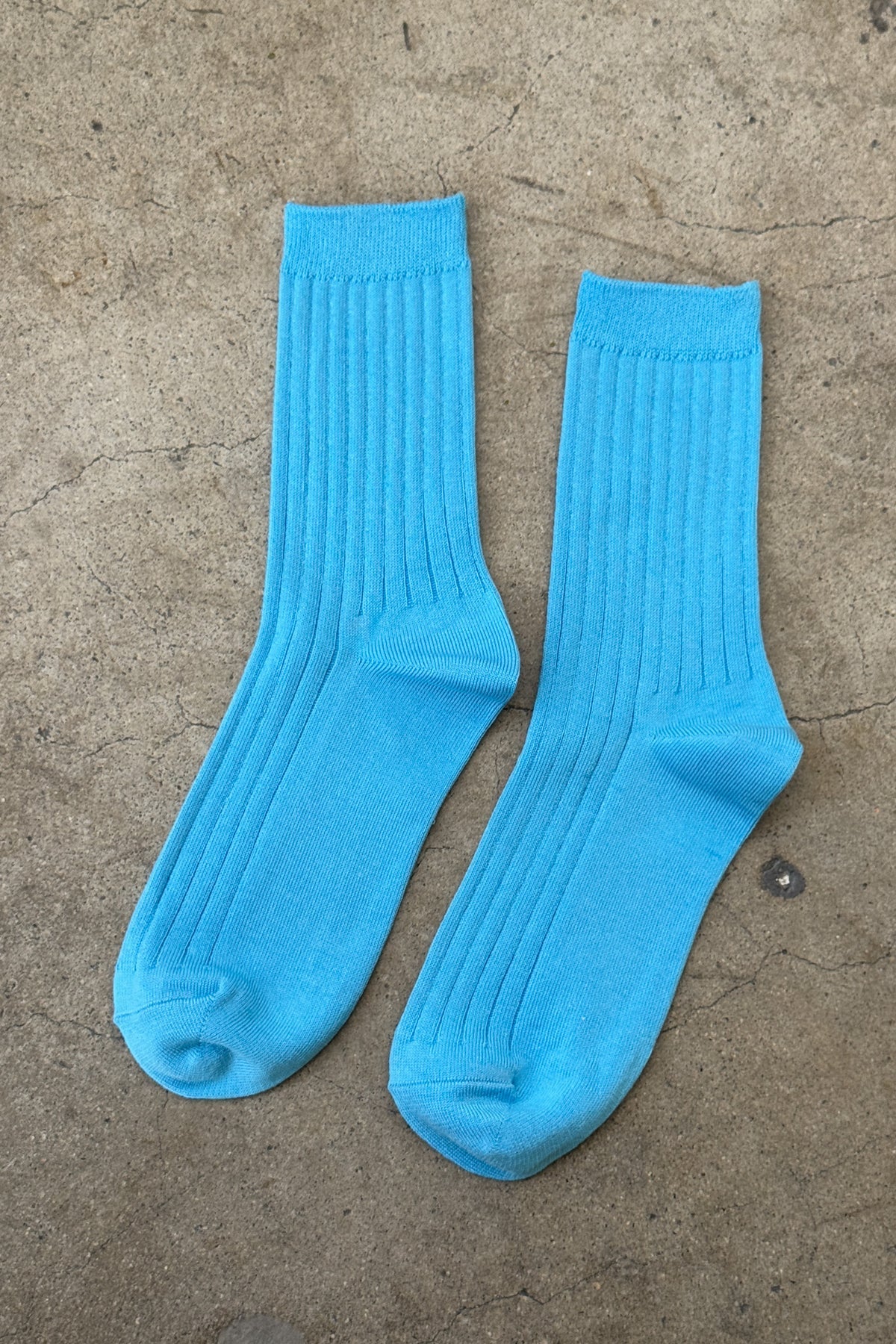 Her Socks in Blue Water